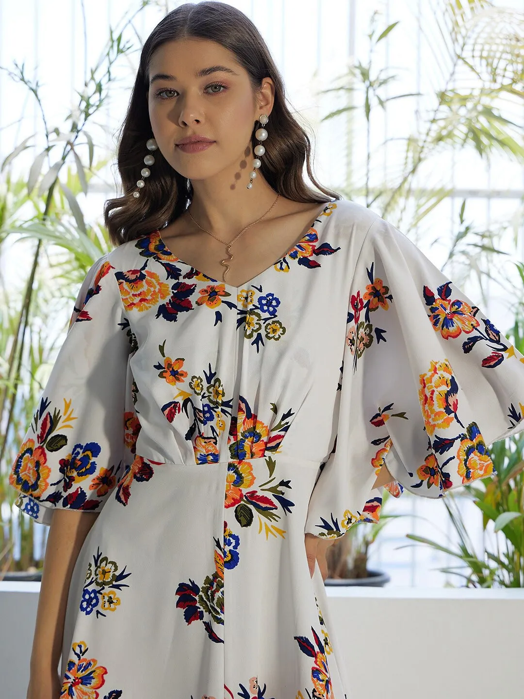 Berrylush Women White & Orange Floral Printed V-Neck Bell Sleeves Flared Maxi Dress