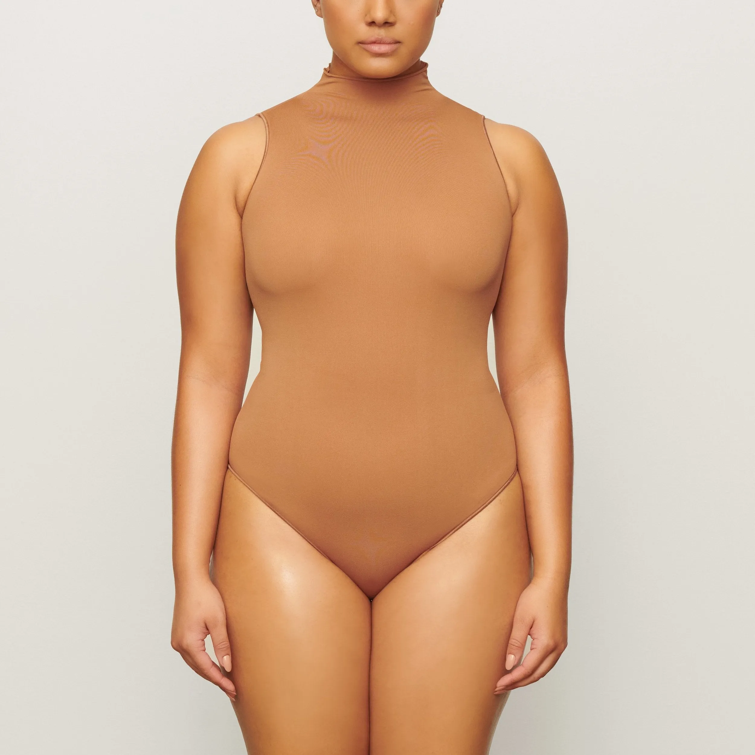 ESSENTIAL MOCK NECK SLEEVELESS BODYSUIT | CAMEL