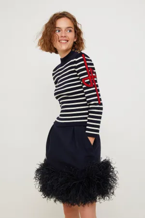 Feather-embellished pleated skirt