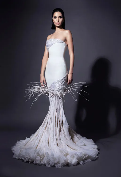Strapless white silk crêpe gown with dramatic breakout mermaid tail in rippling silk organza, adorned with mermaid scales in 3D raffia threadwork, pearls and crystals